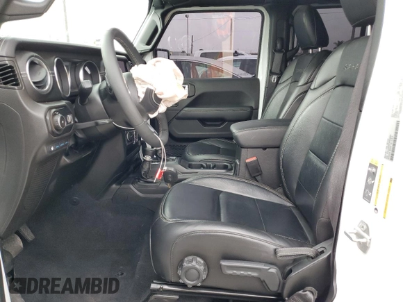2023 Jeep Wrangler Sahara with VIN 1C4JJXP63PW536694, listed as a Copart auction lot 63409845 with 32,560 mi miles and Salvage title. Bid and sale history available at DreamBid. Image 7.