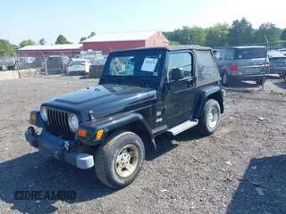 2003 Jeep Wrangler Sahara with VIN 1J4FA59S23P328003, listed as a IAAI auction lot 42833276 with 271,741 mi miles and . Bid and sale history available at DreamBid. Image 2.