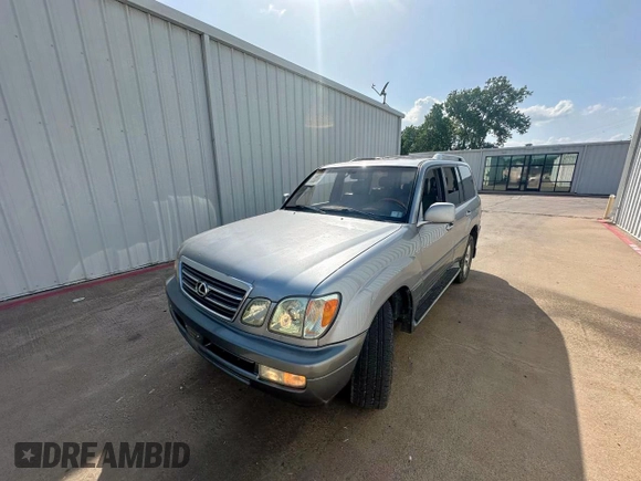 2003 Lexus LX 470 z VIN JTJHT00W933535214, wystawiony jako Copart lot #62037495 z przebiegiem 373 210 mil mil oraz Czysty tytuł • Clean title. Historia ofert i sprzedaży dostępna na DreamBid. Obrazek 2.