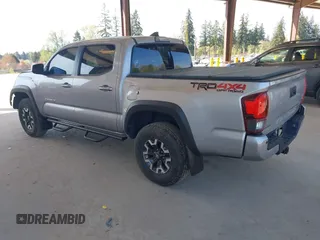 2018 Toyota Tacoma SR with VIN 3TMCZ5ANXJM146284, listed as a IAAI auction lot 42041525 with 103,143 mi miles and . Bid and sale history available at DreamBid. Image 3.