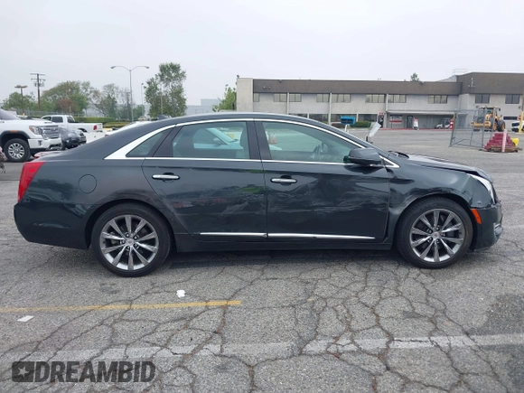 2013 Cadillac XTS Luxury with VIN 2G61P5S33D9215214, listed as a IAAI auction lot 42170402 with 132,045 mi miles and . Bid and sale history available at DreamBid. Image 13.