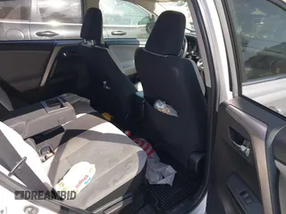 2016 Toyota RAV4 Hybrid XLE with VIN JTMRJREVXGD029019, listed as a IAAI auction lot 42021530 with 74,400 mi miles. Bid and sale history available at carsss.com. Image 8.