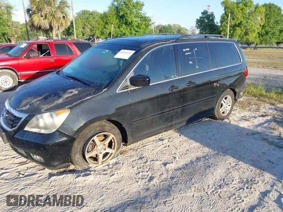 2010 Honda Odyssey Touring with VIN 5FNRL3H95AB031007, listed as a IAAI auction lot 41852435 with 207,919 mi miles. Bid and sale history available at carsss.com. Image 2.