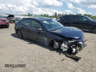 2018 Mazda 3 Touring z VIN 3MZBN1V31JM168860, wystawiony jako Copart lot #61908745 z przebiegiem Nie podano mil oraz Szkoda całkowita • Salvage title. Historia ofert i sprzedaży dostępna na DreamBid. Obrazek 4.