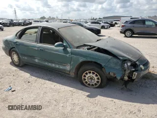 1997 Ford Taurus LX z VIN 1FALP53S1VG316689, wystawiony jako Copart lot #67168694 z przebiegiem 211 414 mil mil oraz Szkody całkowita. Historia ofert i sprzedaży dostępna na DreamBid. Obrazek 4.