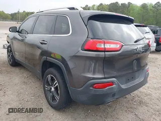 2015 Jeep Cherokee Latitude with VIN 1C4PJLCB0FW601862, listed as a IAAI auction lot 41931048 with 100,705 mi miles and . Bid and sale history available at DreamBid. Image 3.