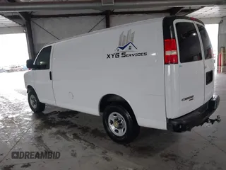 2014 Chevrolet Express Cargo Van with VIN 1GCWGFCA0E1138684, listed as a IAAI auction lot 41796495 with 101,756 mi miles. Bid and sale history available at carsss.com. Image 3.