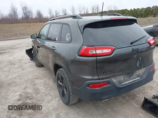 2016 Jeep Cherokee 75th Anniversary with VIN 1C4PJMCB0GW156076, listed as a IAAI auction lot 41946760 with 105,571 mi miles. Bid and sale history available at carsss.com. Image 3.