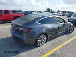 2020 Tesla Model 3 Standard Range Plus with VIN 5YJ3E1EA0LF744046, listed as a IAAI auction lot 41939894 with 102,576 mi miles. Bid and sale history available at carsss.com. Image 4.