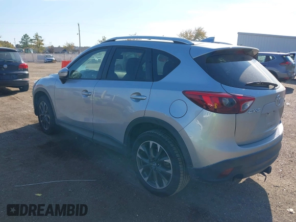 2016 Mazda CX-5 Grand Touring z VIN JM3KE2DY3G0712249, wystawiony jako IAAI lot #37910910 z przebiegiem 262 058 mil mil oraz . Historia ofert i sprzedaży dostępna na DreamBid. Obrazek 3.