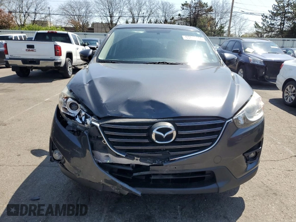 2016 Mazda CX-5 Touring with VIN JM3KE2CY2G0612029, listed as a Copart auction lot 53810155 with 159,915 mi miles and Salvage Title. Bid and sale history available at DreamBid. Image 5.