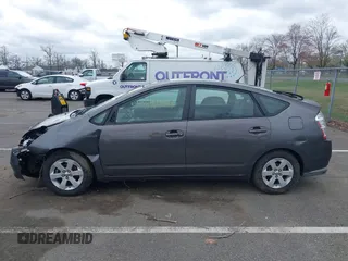 2007 Toyota Prius z VIN JTDKB20U073266399, wystawiony jako IAAI lot #41947176 z przebiegiem 186 258 mil mil oraz . Historia ofert i sprzedaży dostępna na DreamBid. Obrazek 14.