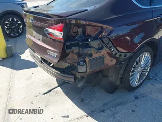 2019 Ford Fusion Hybrid Titanium with VIN 3FA6P0RU2KR123786, listed as a IAAI auction lot 41857026 with 49,604 mi miles. Bid and sale history available at carsss.com. Image 21.