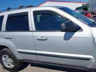 2007 Jeep Grand Cherokee Laredo with VIN 1J8HR48P87C687411, listed as a IAAI auction lot 41774029 with 212,763 mi miles. Bid and sale history available at carsss.com. Image 14.
