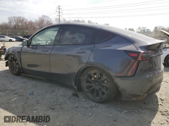 2022 Tesla Model Y Long Range with VIN 7SAYGDEE5NF366493, listed as a Copart auction lot 49874975 with 66,925 mi miles and Salvage Title. Bid and sale history available at DreamBid. Image 2.
