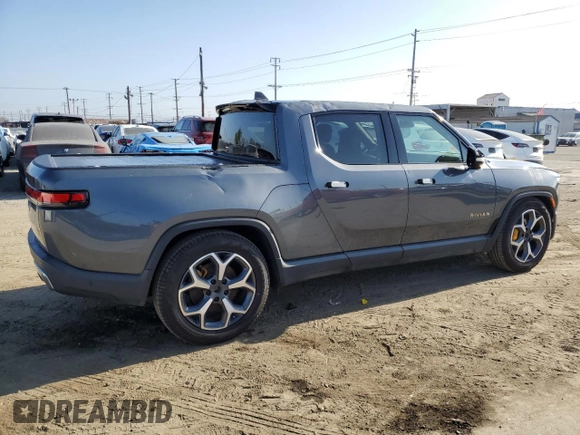 2022 Rivian R1T Adventure z VIN 7FCTGAAA9NN008771, wystawiony jako Copart lot #56243835 z przebiegiem 31 006 mil mil oraz Szkody całkowita. Historia ofert i sprzedaży dostępna na DreamBid. Obrazek 3.