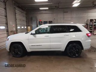2015 Jeep Grand Cherokee Laredo with VIN 1C4RJFAG4FC660665, listed as a IAAI auction lot 41529532 with 124,099 mi miles. Bid and sale history available at carsss.com. Image 14.