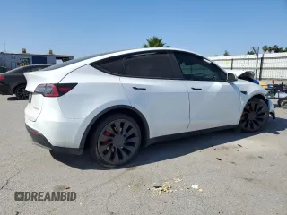 2022 Tesla Model Y Performance with VIN 7SAYGDEF9NF392197, listed as a Copart auction lot 57259105 with 43,400 mi miles and Salvage title. Bid and sale history available at DreamBid. Image 3.