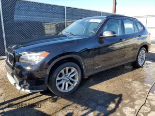 2015 BMW X1 xDrive28i with VIN WBAVL1C5XFVY31850, listed as a Copart auction lot 77491614 with 112,442 mi miles and Clean Title. Bid and sale history available at carsss.com. Image 1.