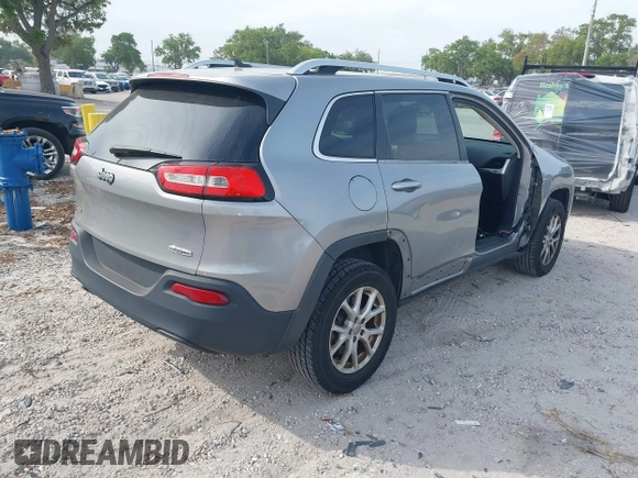 2014 Jeep Cherokee Altitude with VIN 1C4PJMCB4EW107556, listed as a IAAI auction lot 41881448 with 212,816 mi miles and . Bid and sale history available at DreamBid. Image 4.