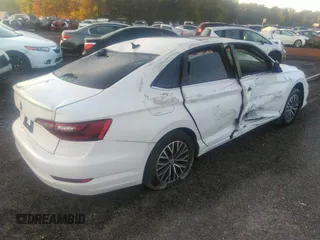 2021 Volkswagen Jetta S z VIN 3VWC57BU1MM017025, wystawiony jako IAAI lot #31656882 z przebiegiem 20 664 mil mil oraz . Historia ofert i sprzedaży dostępna na DreamBid. Obrazek 4.