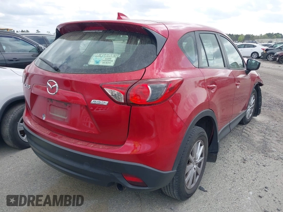 2016 Mazda CX-5 Sport with VIN JM3KE2BY9G0911535, listed as a IAAI auction lot 41906402 with 134,477 mi miles. Bid and sale history available at carsss.com. Image 4.