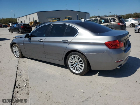 2015 BMW 5 Series 528i xDrive with VIN WBA5A7C51FD623774, listed as a Copart auction lot 46697615 with 165,115 mi miles and Salvage Title. Bid and sale history available at carsss.com. Image 2.