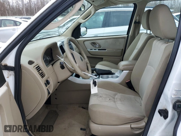 2007 Mercury Mariner Convenience z VIN 4M2YU80Z17KJ17566, wystawiony jako Copart lot #86136014 z przebiegiem 134 328 mil mil oraz Szkody całkowita. Historia ofert i sprzedaży dostępna na DreamBid. Obrazek 7.