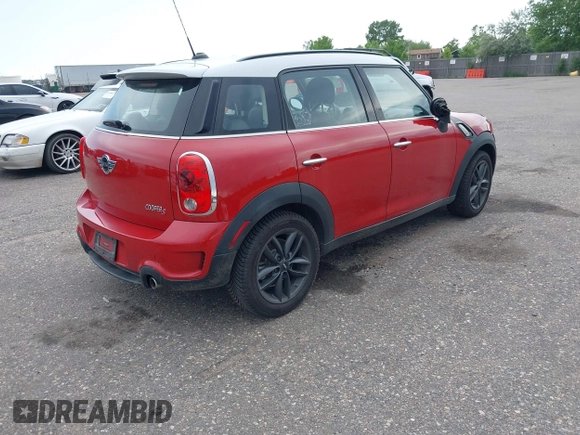 2013 MINI Countryman S with VIN WMWZC3C57DWP21892, listed as a IAAI auction lot 42402600 with 59,700 mi miles and . Bid and sale history available at DreamBid. Image 4.
