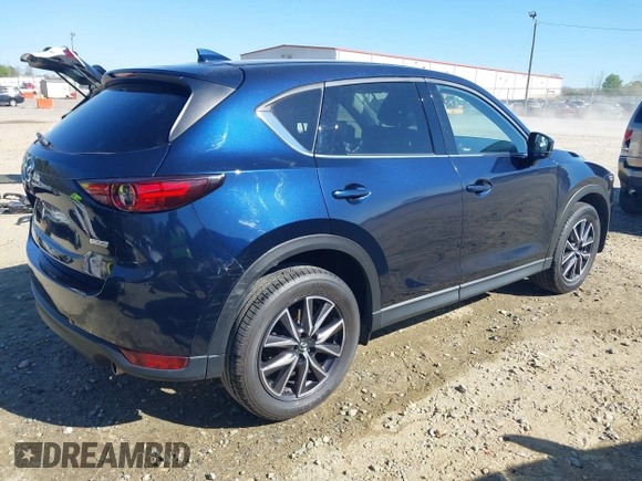 2018 Mazda CX-5 Grand Touring with VIN JM3KFADM1J0322049, listed as a IAAI auction lot 41891079 with 174,939 mi miles and . Bid and sale history available at DreamBid. Image 4.