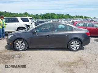 2014 Chevrolet Cruze LS with VIN 1G1PA5SGXE7186074, listed as a IAAI auction lot 42302567 with 152,927 mi miles and . Bid and sale history available at DreamBid. Image 14.