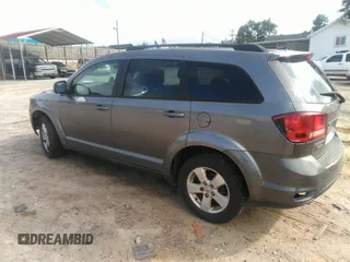 2012 Dodge Journey SXT with VIN 3C4PDCBG9CT153241, listed as a IAAI auction lot 42640265 with 184,719 mi miles and . Bid and sale history available at DreamBid. Image 3.
