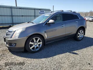 2011 Cadillac SRX Premium Collection with VIN 3GYFNFEYXBS672778, listed as a Copart auction lot 52650365 with 105,164 mi miles and Salvage title. Bid and sale history available at DreamBid. Image 1.