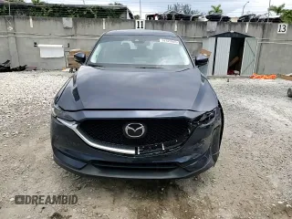 2021 Mazda CX-5 Grand Touring z VIN JM3KFBDM5M0464611, wystawiony jako Copart lot #62829065 z przebiegiem 20 525 mil mil oraz Nie do naprawy • Non repairable. Historia ofert i sprzedaży dostępna na DreamBid. Obrazek 14.