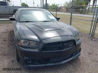 2012 Dodge Charger SRT8 with VIN 2C3CDXEJ7CH169853, listed as a IAAI auction lot 41857468 with 145,016 mi miles. Bid and sale history available at carsss.com. Image 1.