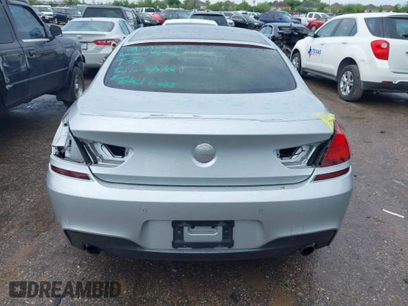 2015 BMW 6 Series 640i z VIN WBA6A0C51FD318982, wystawiony jako IAAI lot #41875547 z przebiegiem 60 968 mil mil oraz . Historia ofert i sprzedaży dostępna na DreamBid. Obrazek 6.