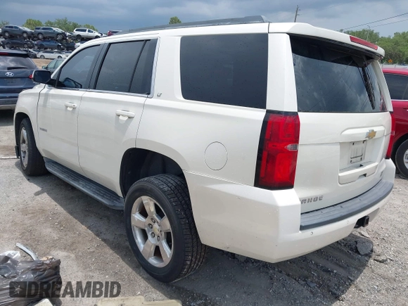 2015 Chevrolet Tahoe LT with VIN 1GNSCBKC0FR739951, listed as a IAAI auction lot 42332982 with 133,046 mi miles and . Bid and sale history available at DreamBid. Image 3.