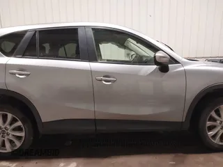 2015 Mazda CX-5 Grand Touring with VIN JM3KE4DY2F0477966, listed as a IAAI auction lot 41247178 with 116,582 mi miles. Bid and sale history available at carsss.com. Image 14.