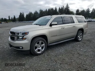 2015 Chevrolet Suburban LT z VIN 1GNSKJKC1FR148671, wystawiony jako Copart lot #56761995 z przebiegiem 118 981 mil mil oraz Szkoda całkowita • Salvage title. Historia ofert i sprzedaży dostępna na DreamBid. Obrazek 1.