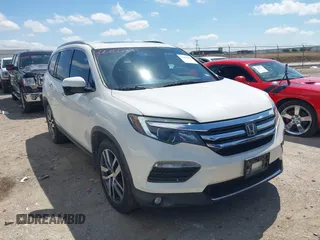 2017 Honda Pilot Touring with VIN 5FNYF6H92HB054145, listed as a IAAI auction lot 42200391 with 70,096 mi miles and . Bid and sale history available at DreamBid. Image 1.