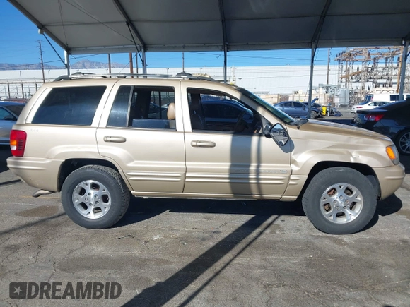 1999 Jeep Grand Cherokee Limited with VIN 1J4GW68NXXC727844, listed as a IAAI auction lot 41290773 with 222,838 mi miles. Bid and sale history available at carsss.com. Image 14.