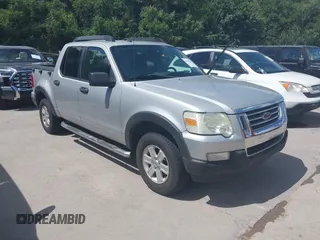 2010 Ford Explorer Sport Trac XLT z VIN 1FMEU3BE2AUA34810, wystawiony jako IAAI lot #42554325 z przebiegiem 166 050 mil mil oraz . Historia ofert i sprzedaży dostępna na DreamBid. Obrazek 1.