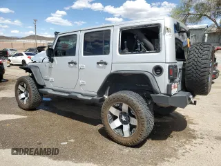 2012 Jeep Wrangler Unlimited Altitude with VIN 1C4HJWEG8CL163653, listed as a Copart auction lot 55279045 with 107,076 mi miles and Salvage title. Bid and sale history available at DreamBid. Image 2.