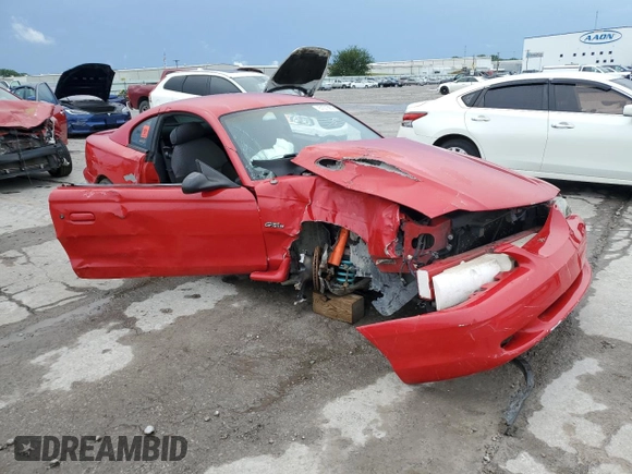 1996 Ford Mustang GT with VIN 1FALP42X4TF131093, listed as a Copart auction lot 61013915 with 158,297 mi miles and Salvage title. Bid and sale history available at DreamBid. Image 4.