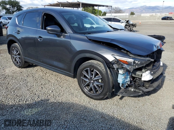 2018 Mazda CX-5 Grand Touring with VIN JM3KFADM8J1330353, listed as a Copart auction lot 54752325 with 96,577 mi miles and Salvage Title. Bid and sale history available at DreamBid. Image 4.
