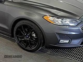 2020 Ford Fusion SE z VIN 3FA6P0HD6LR189762, wystawiony jako IAAI lot #42780149 z przebiegiem 51 099 mil mil oraz . Historia ofert i sprzedaży dostępna na DreamBid. Obrazek 20.
