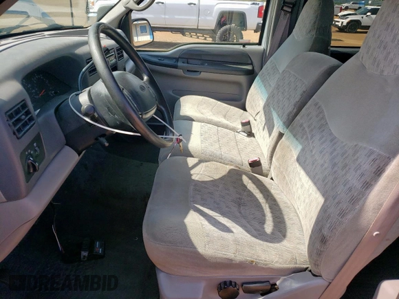 1999 Ford F-350 XL with VIN 1FTSW31S2XEE89071, listed as a Copart auction lot 61016685 with 115,130 mi miles and Salvage title. Bid and sale history available at DreamBid. Image 7.