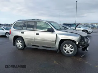 2003 GMC Envoy SLT with VIN 1GKDT13S532308502, listed as a IAAI auction lot 41676188 with 218,626 mi miles. Bid and sale history available at carsss.com. Image 13.