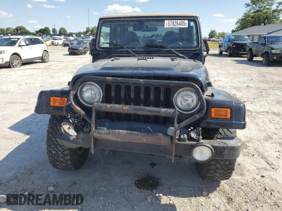 2001 Jeep Wrangler Sahara with VIN 1J4FA59S71P343366, listed as a Copart auction lot 57826405 with 156,436 mi miles and Salvage title. Bid and sale history available at DreamBid. Image 5.