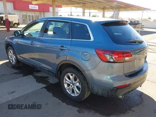 2014 Mazda CX-9 Sport with VIN JM3TB3BA5E0427753, listed as a IAAI auction lot 41679267 with 135,993 mi miles and . Bid and sale history available at DreamBid. Image 3.